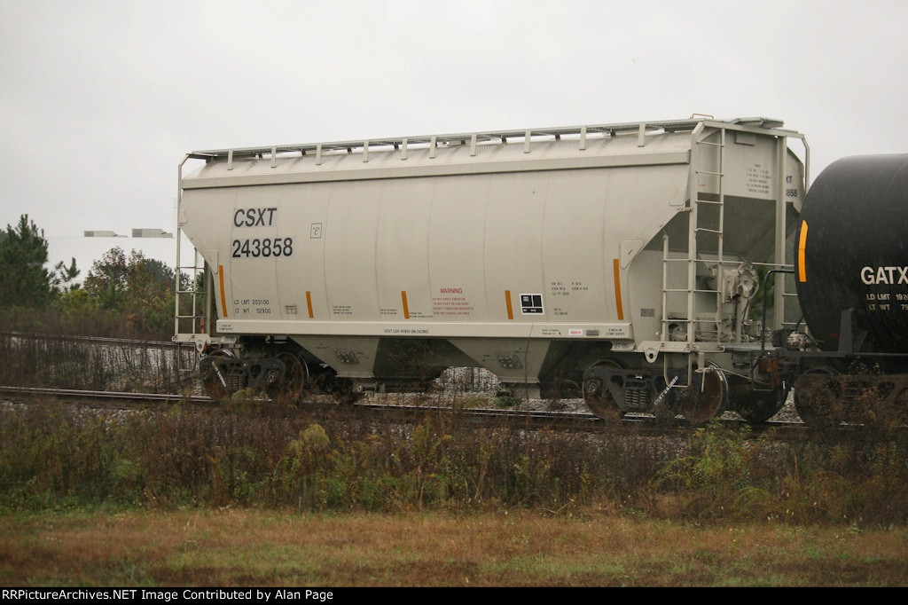 CSXT 243858 covered hopper at the tail end